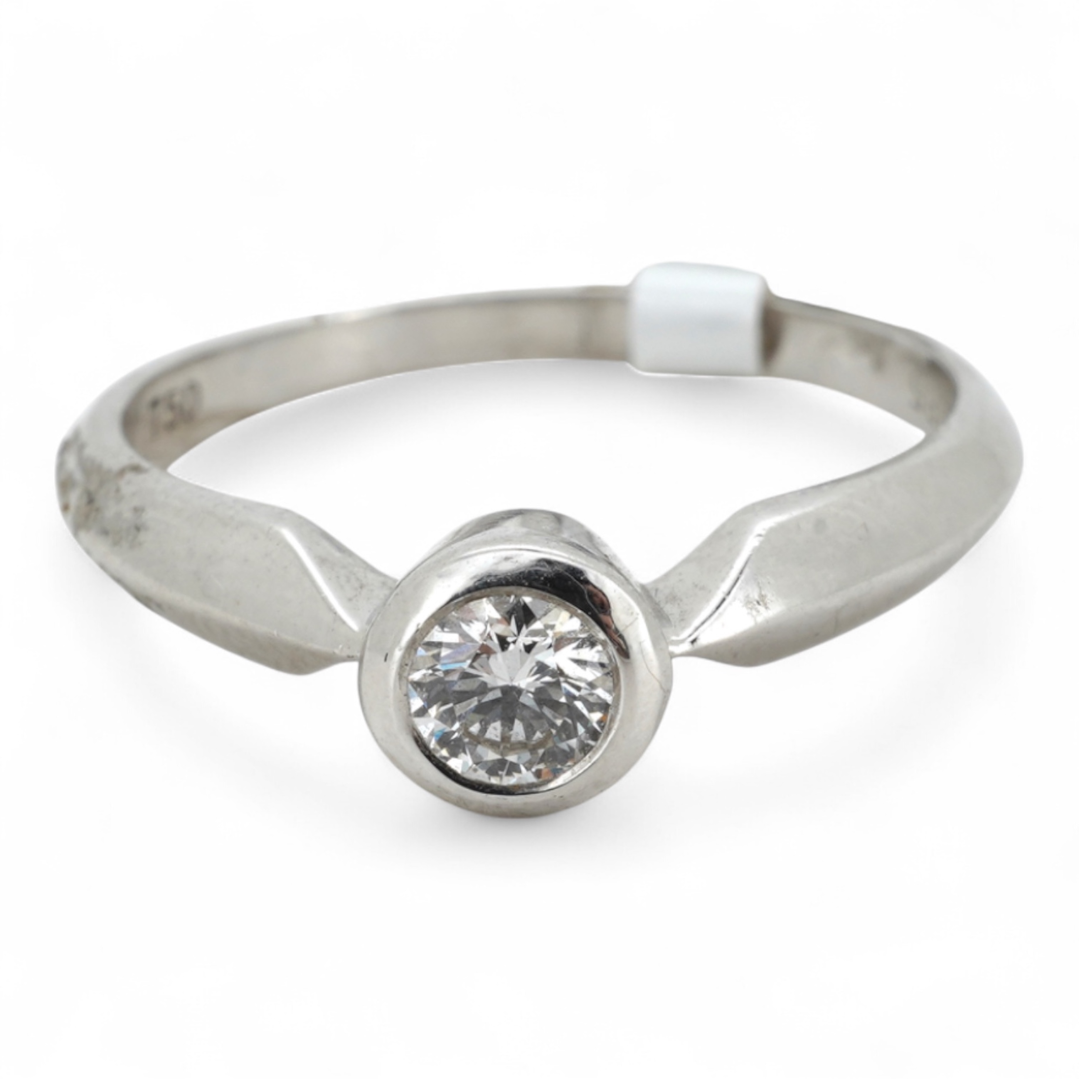 A diamond ring, collet-set with a brilliant-cut diamond weighing approximately 0.35 carats, mounted in 18ct white gold, size M, British hallmarks, gross weight approximately 2 grams